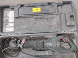 a tool in a case that is sitting on the floor
