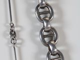 two chains that are attached to each other on a table