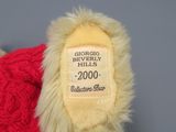 a teddy bear with a label on it ' s back
