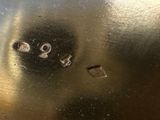 a close up of a silver plate with numbers on it