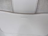 the inside of a white purse with a zipper on it