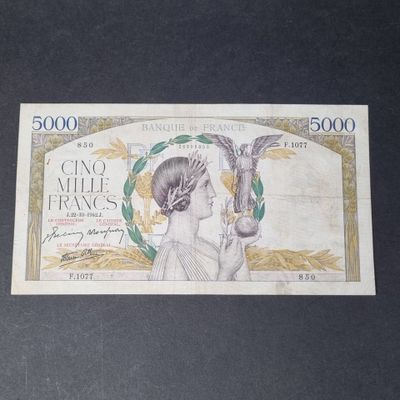 a picture of a bank note with a woman holding a bird