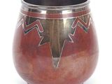 a vase with a design on it on a white surface