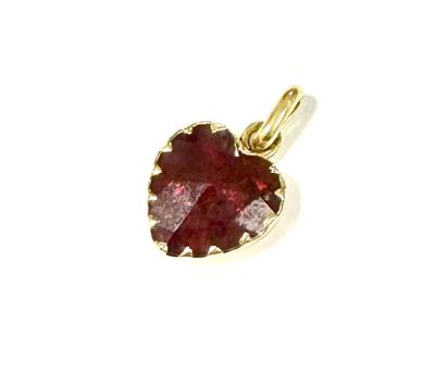 an image of a red garnet stone pendant on a white background