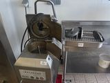 a machine that is sitting on the floor in the kitchen