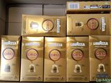 several boxes of coffee are stacked on top of each other
