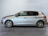 the silver car is parked in a large room with a gray floor