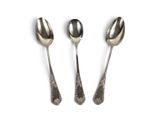 three spoons and two spoon spoons on a white surface