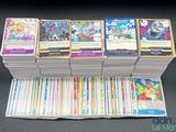 a lot of cards that are stacked on top of each other