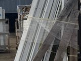 a pile of windows sitting on top of a pallet