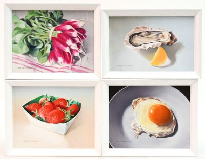 four paintings of food displayed in a white frame on a table