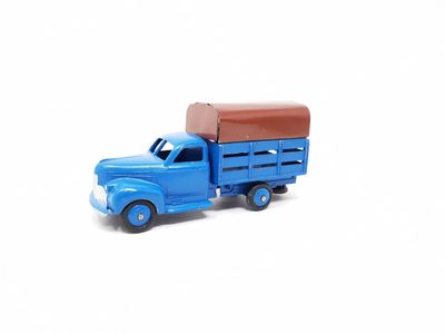 a blue toy truck with a brown roof on a white background