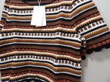 an image of a brown and black striped shirt with a tag on it