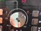 a close up of a coffee machine with a person ' s hand on it