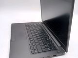 a laptop that is sitting on a white table