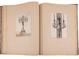 an open book with a drawing of a chandelier on it
