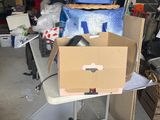 a cart with a box on top of it in a garage