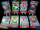 plusieurs paquets de cartes à collectionner Pokémon exposés sur un fond noir