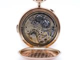 an image of a gold pocket watch with a white background