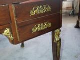 a desk with a drawer on top of it in a room
