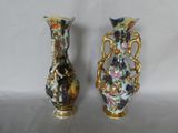 two vases sitting side by side on a white surface