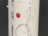 an image of a water heater with a hose attached to it