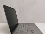 the laptop is sitting on the table with its lid open
