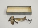 an old fishing lure in a box with a fishing hook