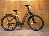a bike that is parked in front of a wooden wall