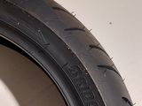 a tire that is sitting on a white surface