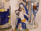 three figurines that are sitting next to each other