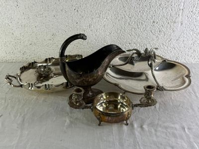 a silver plate and a silver bowl on a table