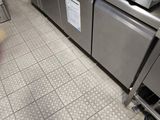 a large stainless steel stove in a commercial kitchen