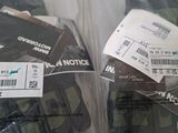 two packages of electronic devices wrapped in plastic bags