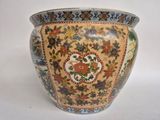 a vase with a floral design on it on a white surface