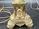 a lamp that is sitting on a table next to a cord
