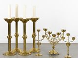 brass candlesticks and candelabs in various sizes and shapes