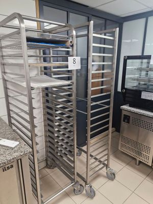 a picture of a commercial kitchen with a lot of trays of food