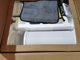 a cardboard box with a laptop inside of it