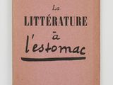 a pink book with black writing on the cover of it