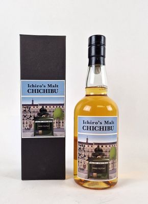 an image of a bottle of whisky next to a box