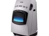 a white portable heater sitting on top of a white table