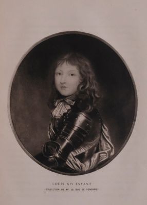 an old black and white photo of a young boy in armor