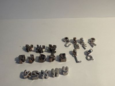 a lot of different type of letters and numbers on the table