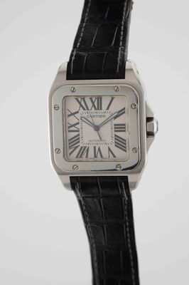 an image of a wrist watch with roman numerals on a black strap