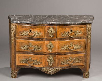 an antique chest of drawers with marble top and gold accents