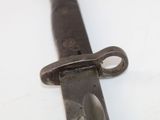 a close up of a knife on a white surface