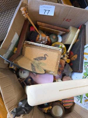 a cardboard box full of assorted items in it