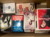a lot of books on the shelf in the box