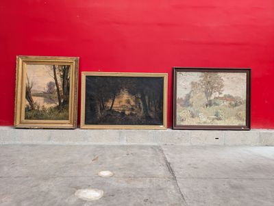 three paintings on the wall next to a red wall